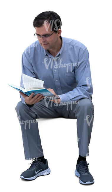 man sitting and reading a book