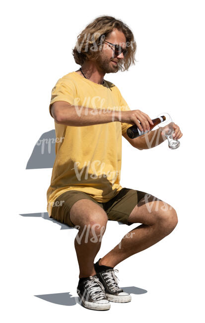 man sitting and drinking beer