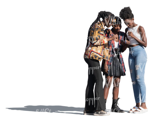 three black women standing and looking at a phone