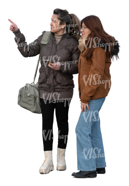 two women in autumn standing and pointing at smth