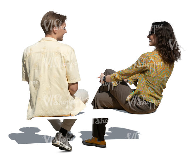 man and woman sitting and talking