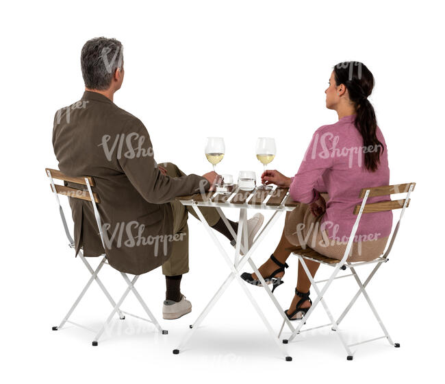 man and woman sitting in a restaurant seen from back angle