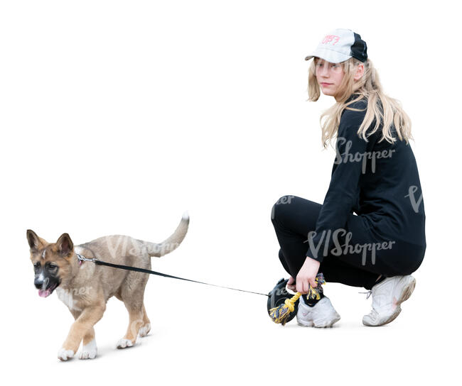 girl with a puppy squatting