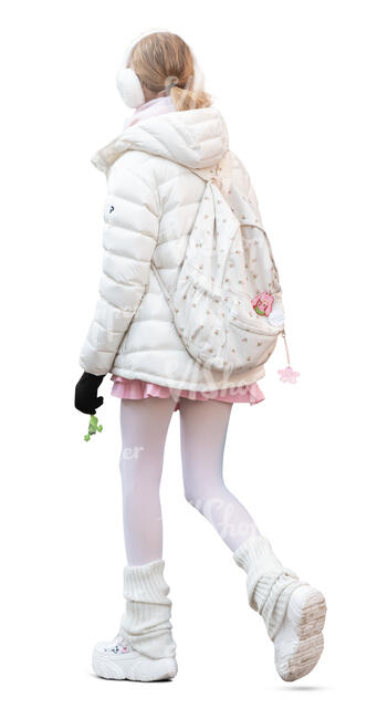 girl with white earmuffs walking