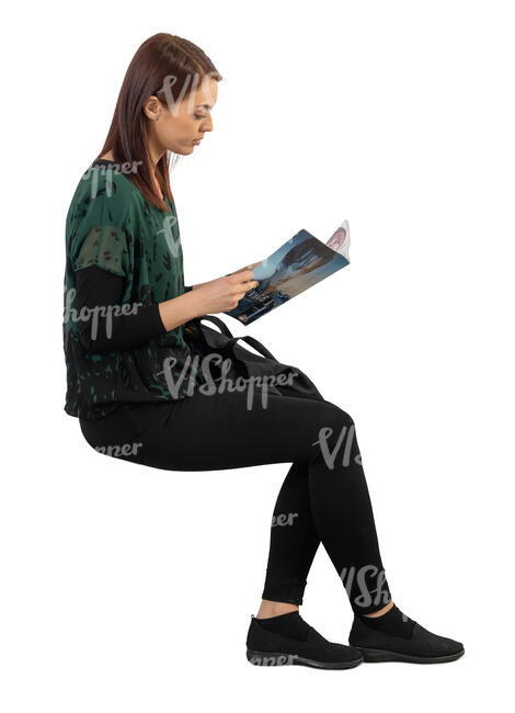 woman sitting and reading a magazine