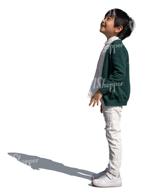 little asian boy standing and looking up