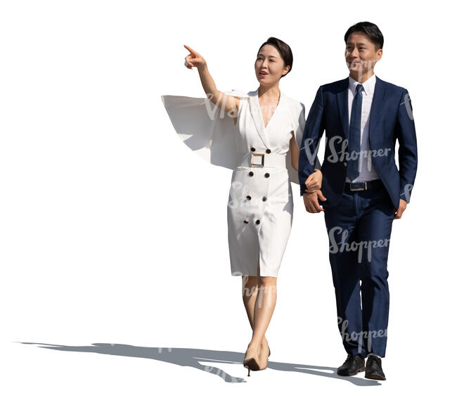 asian man and woman walking hand in hand