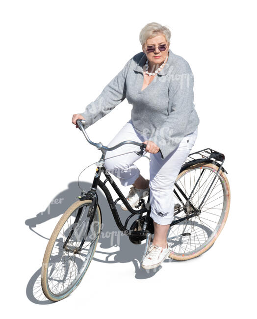 older woman ridin a bike seen from above