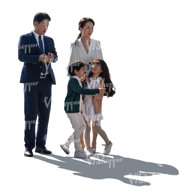 backlit asian family with two playful kids standing