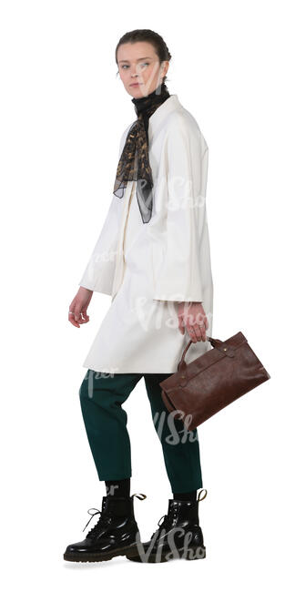 woman in a white coat walking