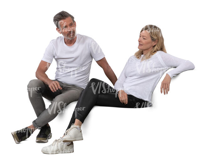 middle aged man and woman sitting on a sofa