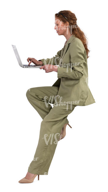 woman sitting and working with laptop