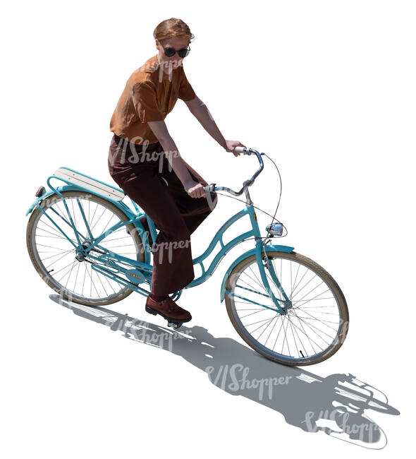top backlit view of a woman riding a bike
