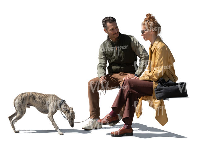 man and woman with a dog sitting and talking