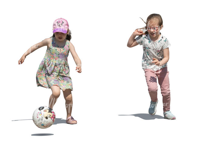 two little girls playing football