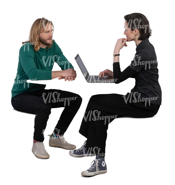 man and woman sitting by the table and working with computer