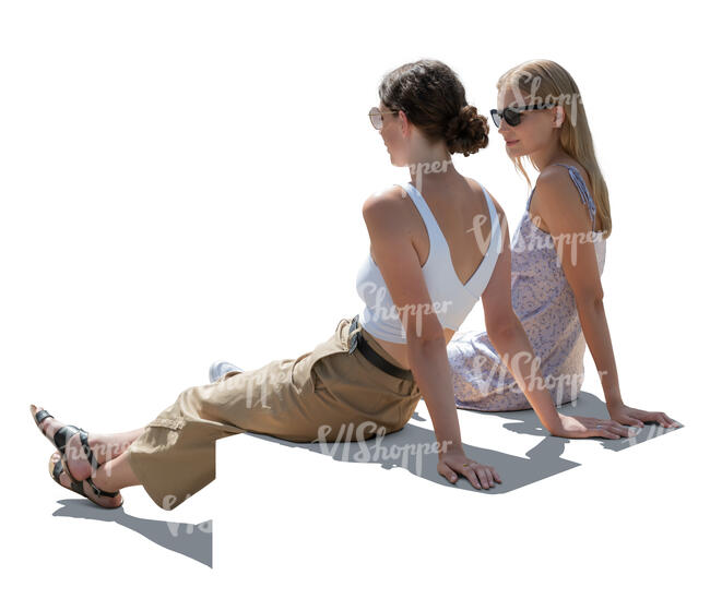 two backlit women sitting
