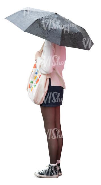 woman with an umbrella standing in the rain