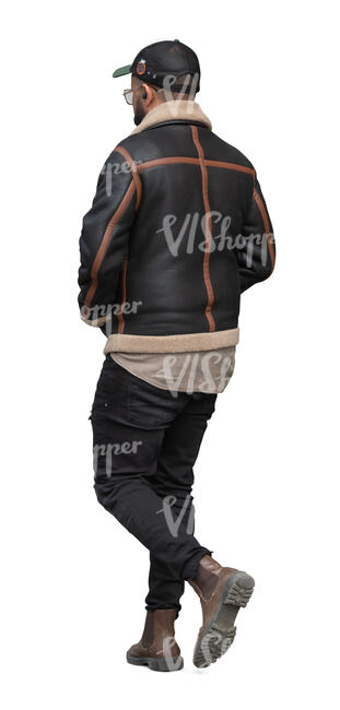 black man with a baseball cap walking