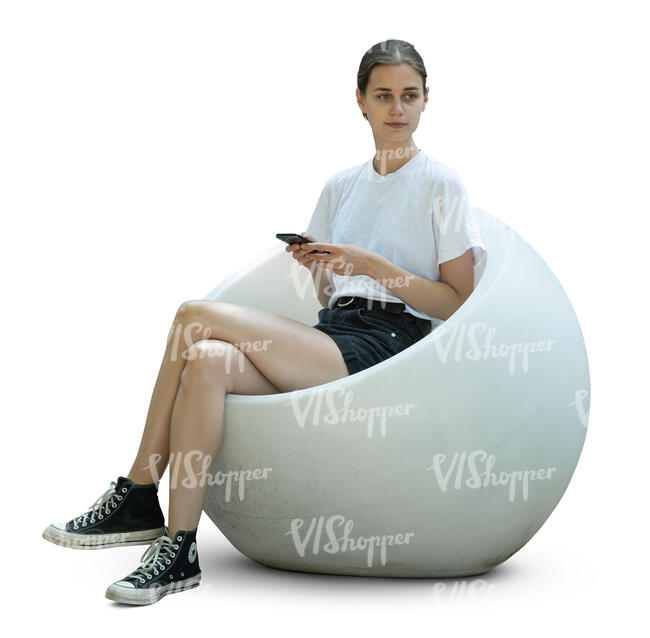 woman sitting in a ball shaped chair
