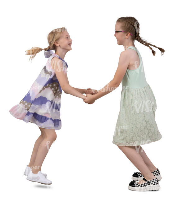 two girls holding hands and dancing