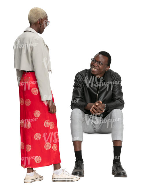 black man sittin and talking to a woman standing by her