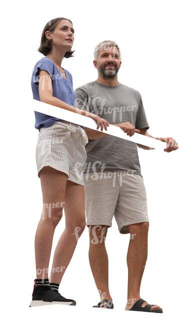 man and woman standing up on a balcony