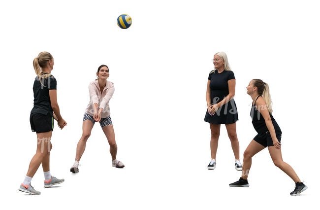 group of women playing volleyball