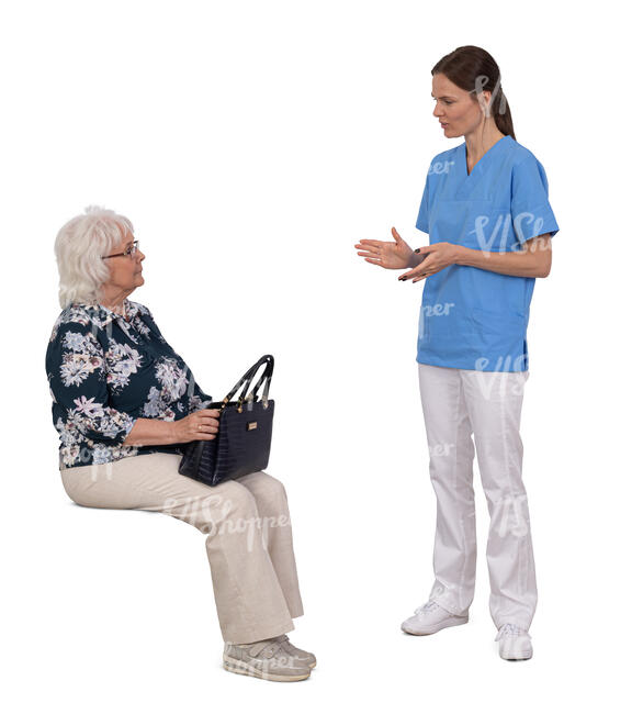 older lady sitting and listening to a medical worker