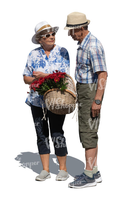 elderly couple with a basket of flowers standing