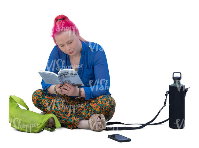 woman sitting on the floor and reading