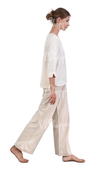 woman in white clothing walking barefoot
