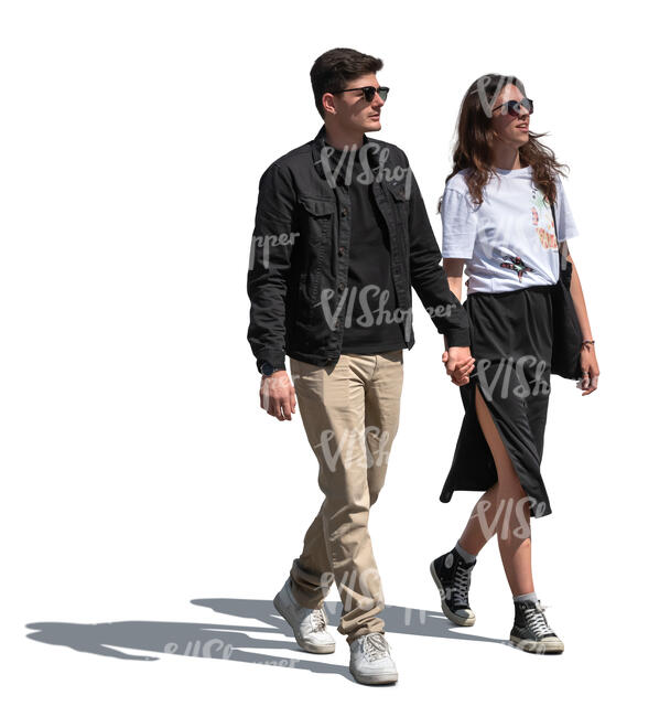 dark haired couple walking hand in hand