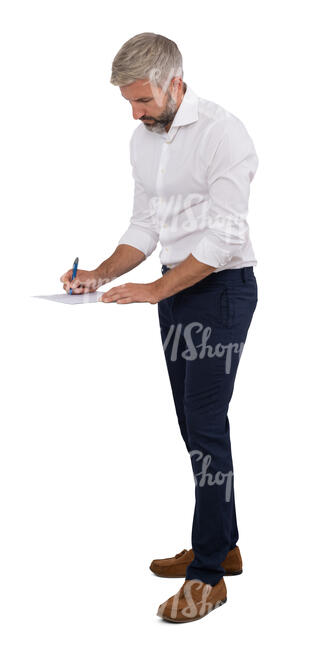 man standing and writing smth on the desk