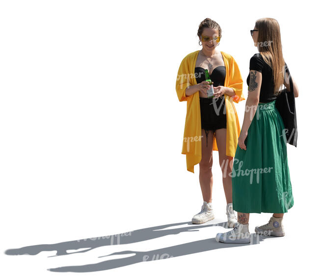 two backlit women standing