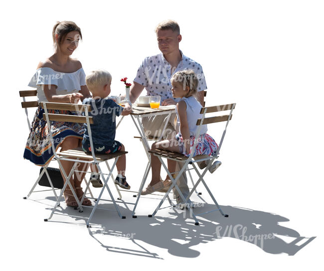 backlit family with small kids sitting in a cafe