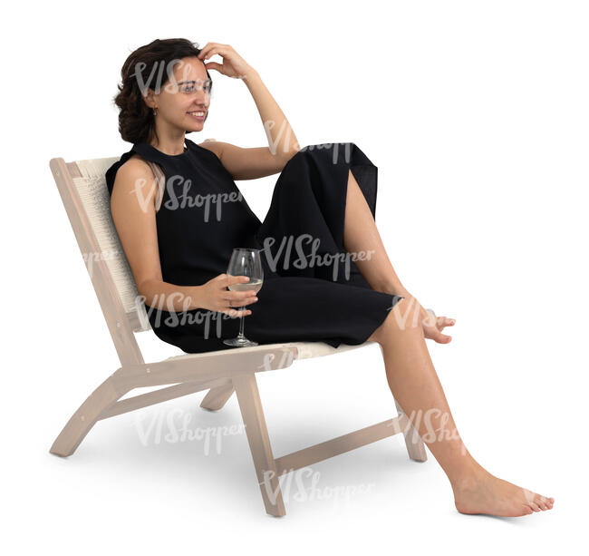 woman in a black dress sitting casually and drinking wine