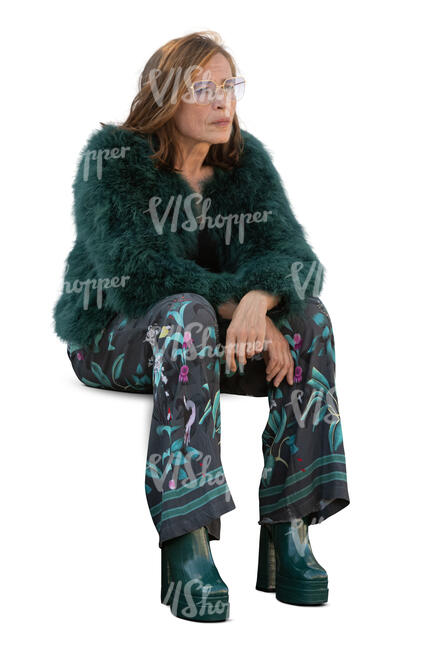 woman in a green furry jacket sitting