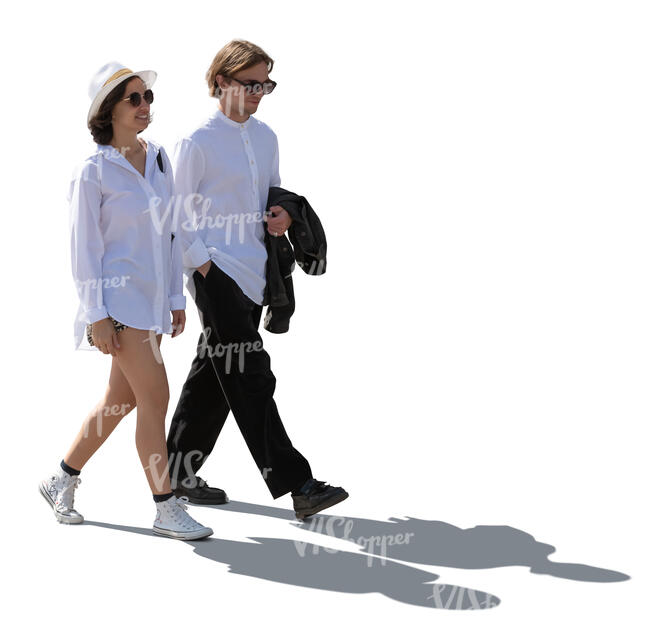 backlit man and woman in resort style clothing walking