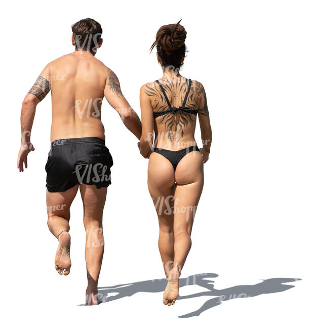 man and woman running on the beach