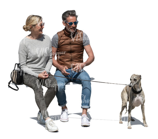 man and woman with a dog sitting and talking