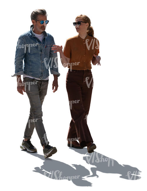 backlit man and woman walking and talking