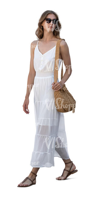 woman in a white summer dress walking