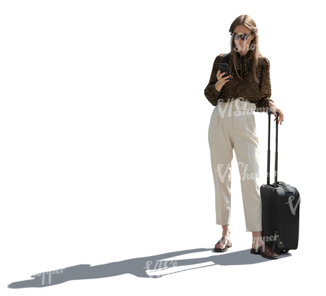 backlit woman with a suitcase standing