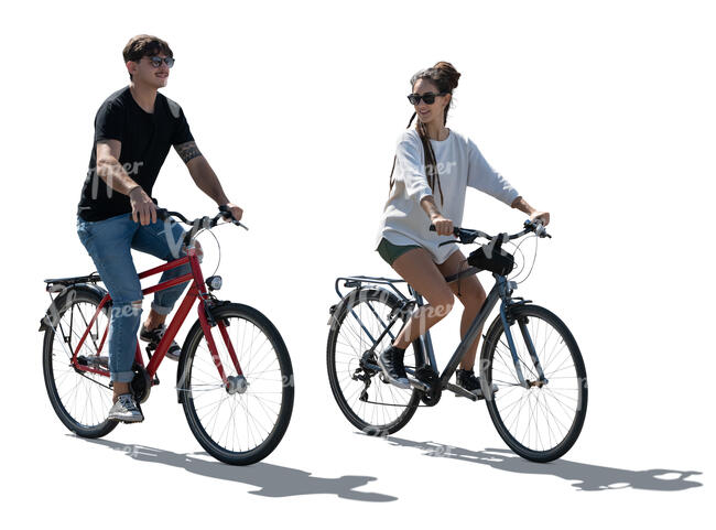 backlit man and woman cycling