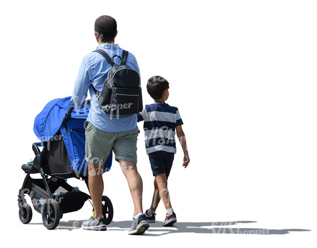 man walking pushing a stroller and holding his son by the hand