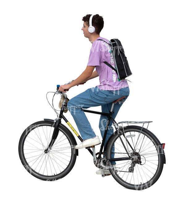 teenage boy with headphones and backpack riding a bike