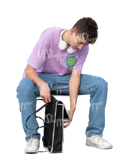 young man with a backpack sitting