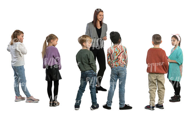 group of children standing and listening to their teacher