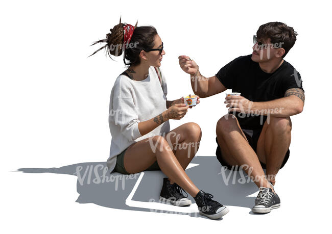 man and woman sitting and eating ice cream